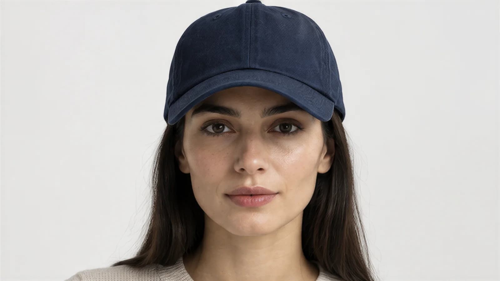 Navy cap worn by a model, front view