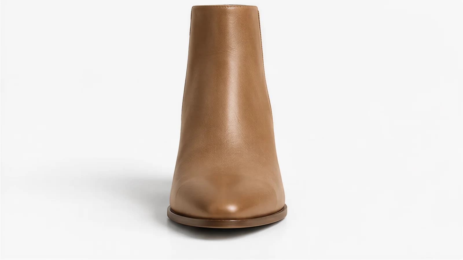 One tan leather ankle boot seen straight on from the toe