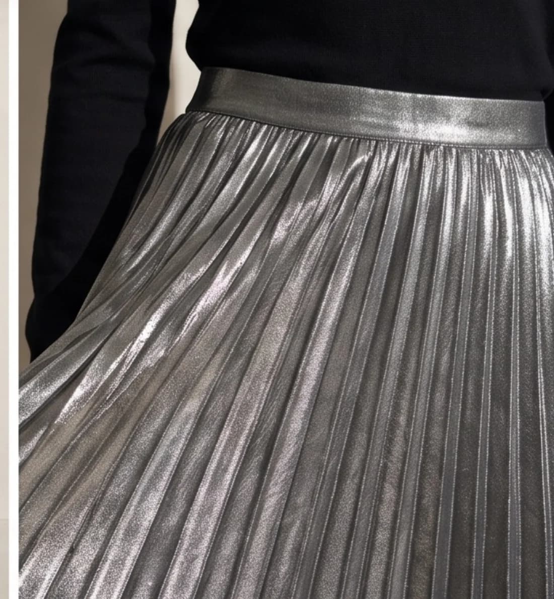 Metallic pleated skirt, print and logo close-up
