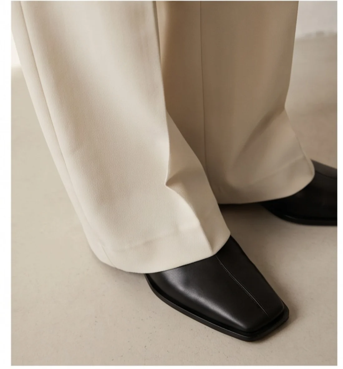 Wide-leg tailored trousers, print and logo close-up